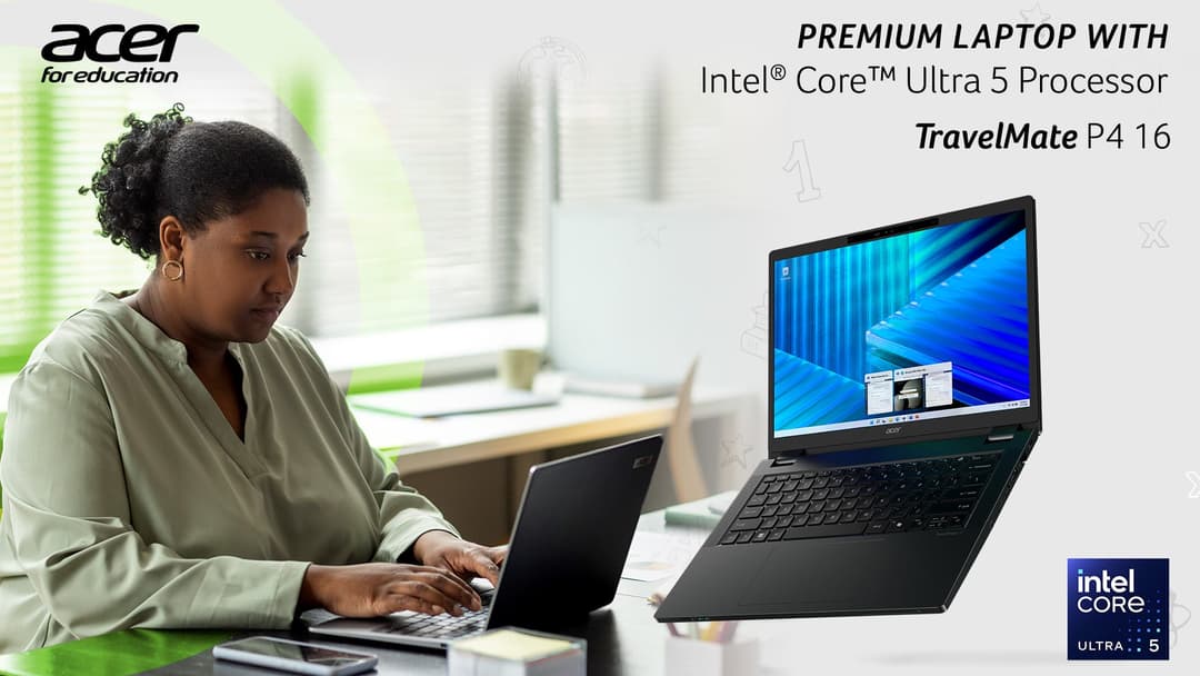 A woman sitting at a desk using a laptop computer