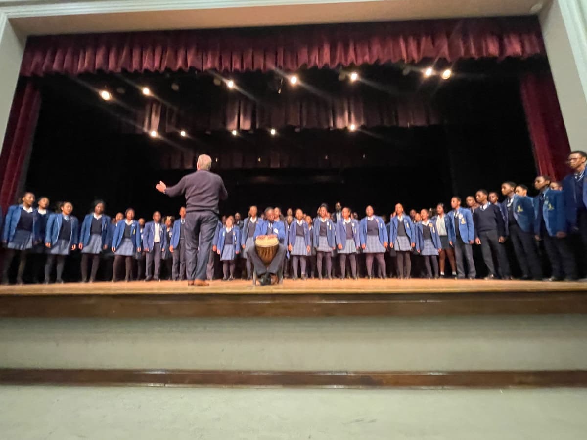 A group of people standing on top of a stage