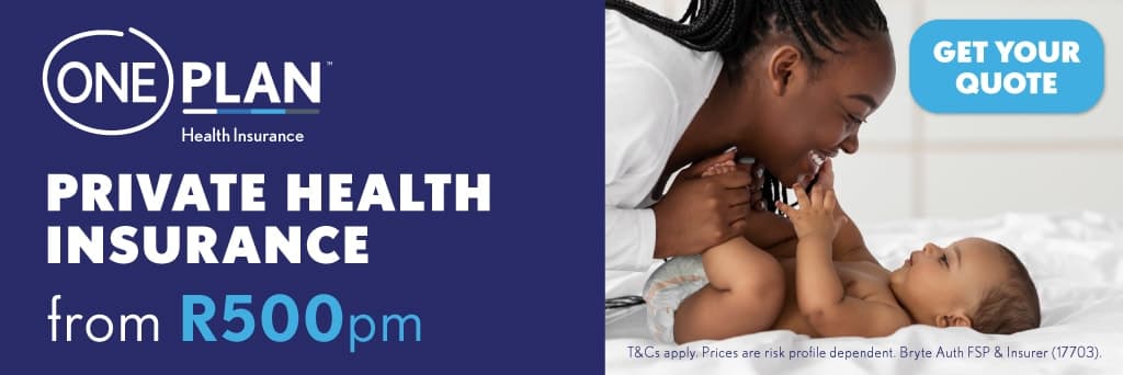 A woman is holding a baby in her arms