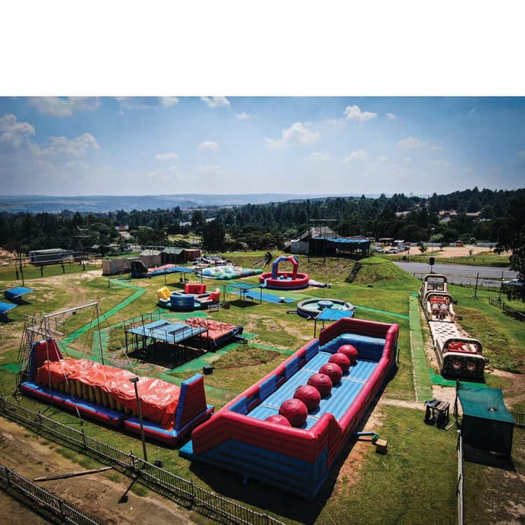 A large inflatable water slide in a park