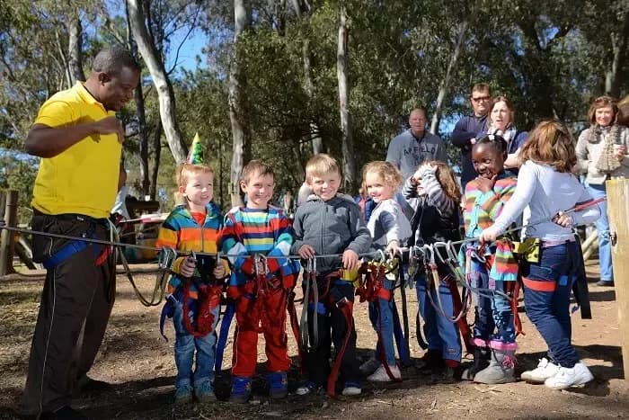 A group of children standing next to each other