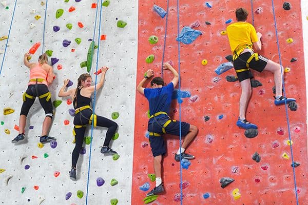 A group of people on a climbing wall