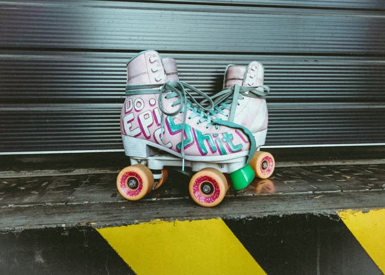 A pair of pink and green roller skates