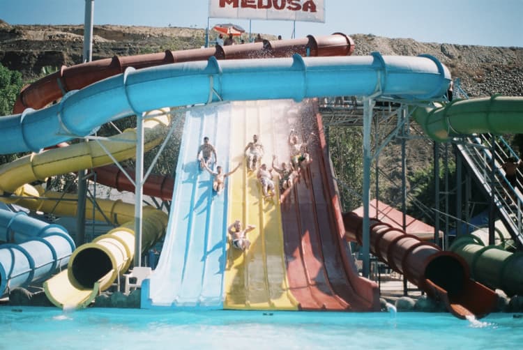 A large water slide with people on it