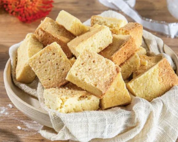 A bowl full of shortbreads on a table